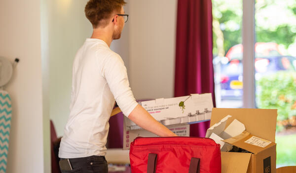 Student moving boxes