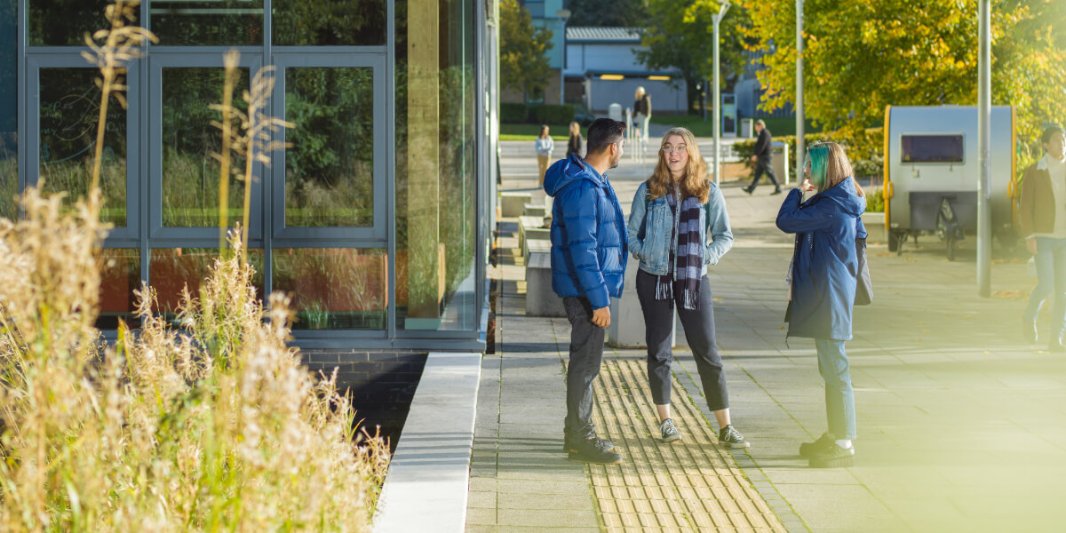 students stood besides LICA building