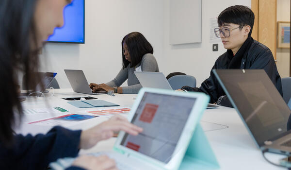 Students working at laptops