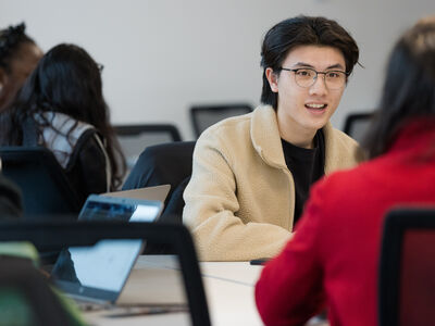 A student in a lively discussion
