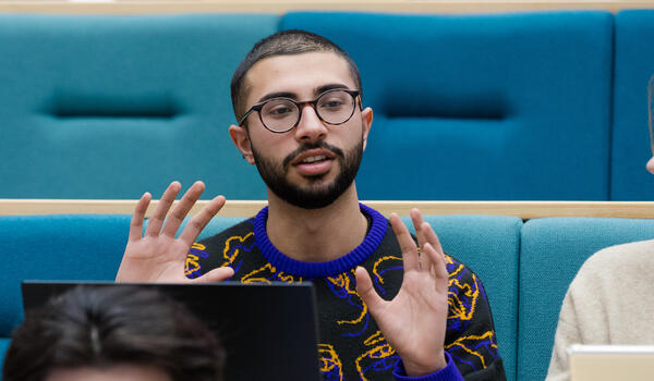 Student sitting in a modern lecture theatre