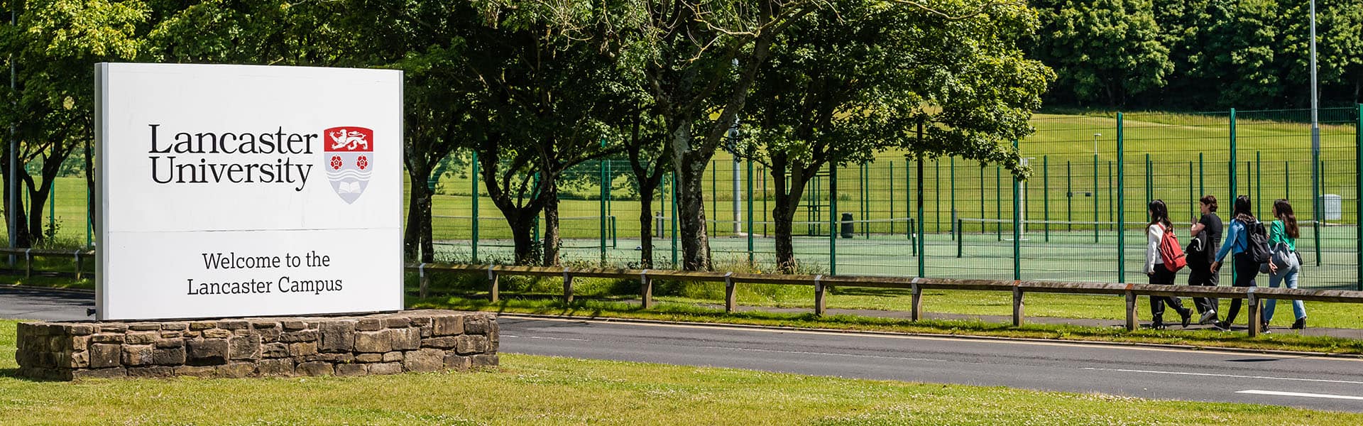 Campus main drive with Lancaster University sign