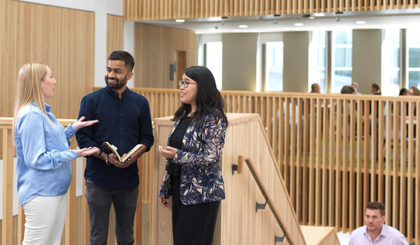 Group of professionals in Management School building
