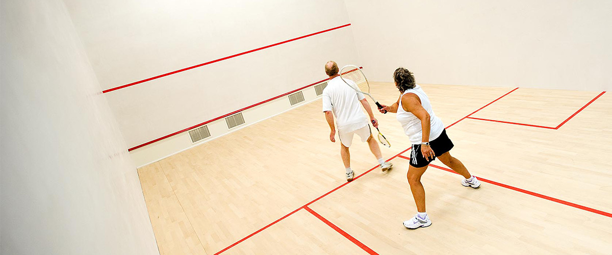 Two people playing squash