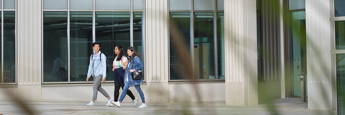 Students walking outside the west pavilion building 